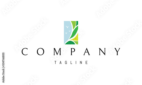 Vector logo on which an abstract image of a tree against the blue sky.