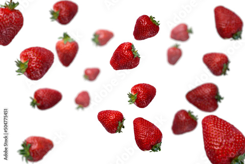 flying strawberry isolated on white background. Strawberries hung in the air. Strawberry explosion. selective focus