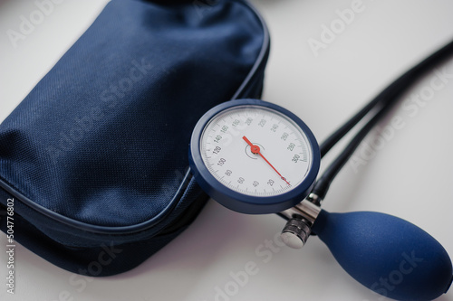 Tonometer on a white background. Diagnostic device for determining blood pressure and pulse rate