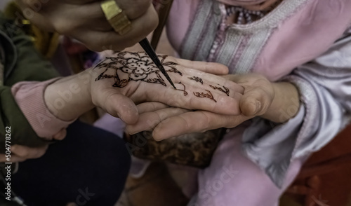 Henna tattoo on the hand photo