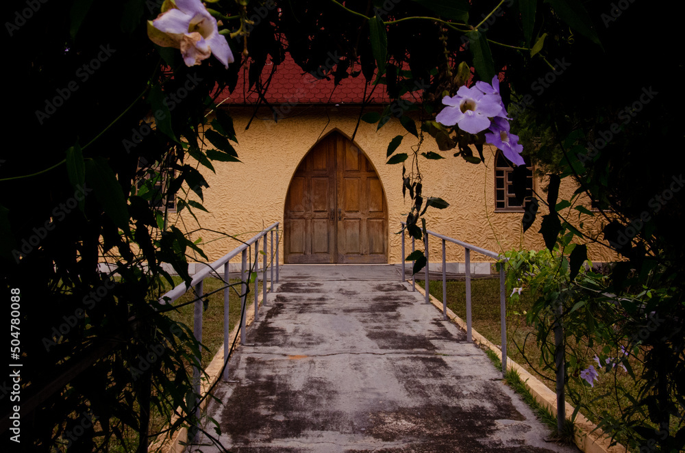 Obraz premium Wooden side door of a Catholic chapel.