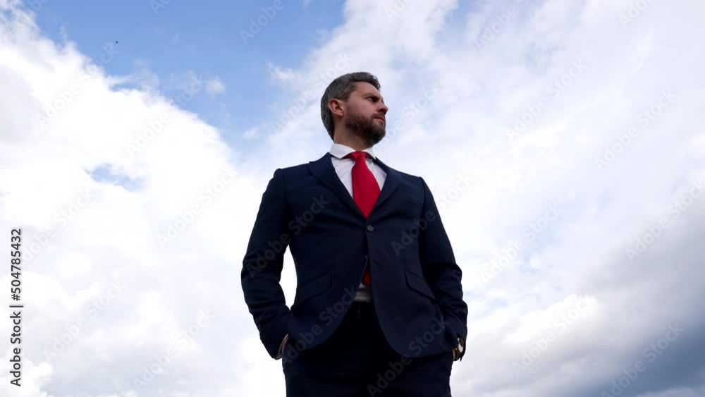 serious bearded man in business suit on sky background, business fashion serious bearded man in business suit on sky background, business fashion