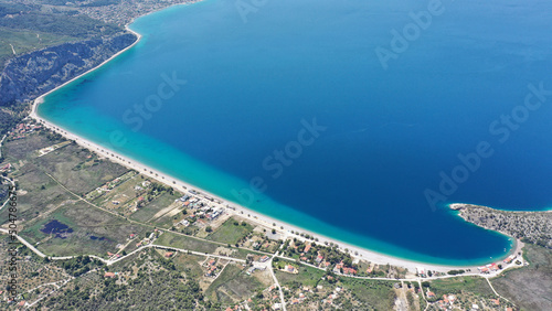 Aerial photo of famous sandy beach of Psatha in West Attica with emerald clear sea, Corinthian gulf, Greece