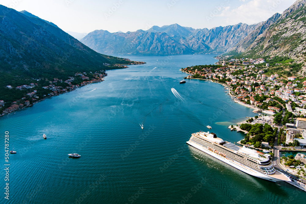 Montenegro. Bay of Kotor. The largest bay on the Adriatic Sea. The southernmost fjord in Europe. Drone. Top view of the city of Kotor. Tourist liner in the parking lot. Popular tourist place