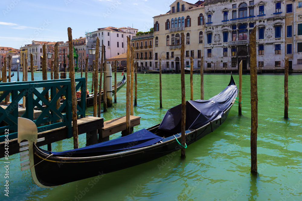 Gondola moored along the grand canal in Venice