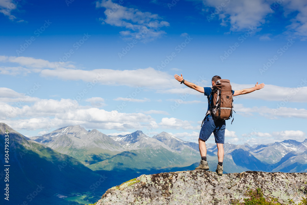 Hiker on the mountain ridge. Sport and active life concept Hiker on the mountain ridge. Sport and active life concept