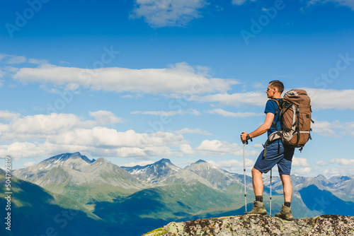 Hiker on the mountain ridge. Sport and active life concept