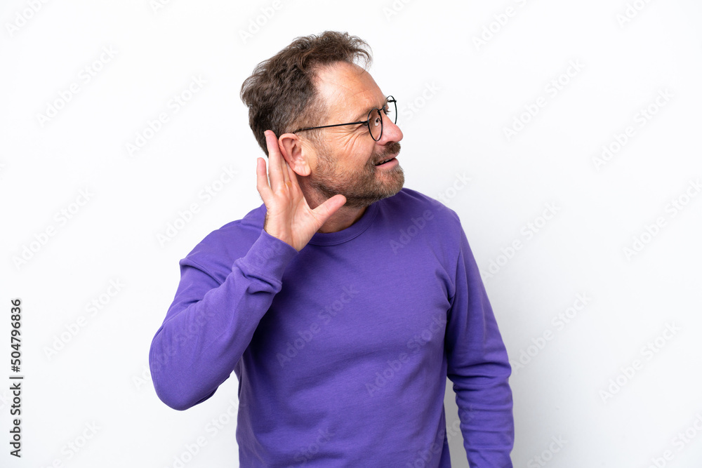 Middle age caucasian man isolated on white background listening to something by putting hand on the ear Middle age caucasian man isolated on white background listening to something by putting hand on the ear