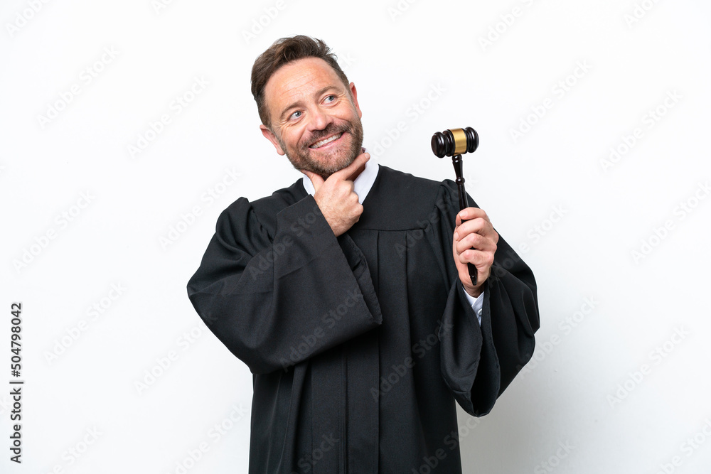Naklejka premium Middle age judge man isolated on white background looking up while smiling