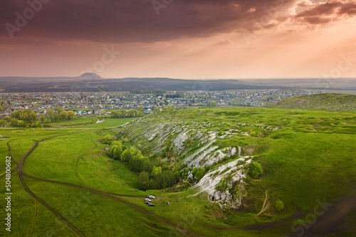 A landscape with a karst plateau and the famous landmark of Bashkortostan and Russia - the Shikhan Mountains. Geology and Ecology concept photo