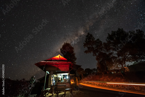 Wallpaper Mural Milky way over small stall that selling traditional indonesian food, coffee and instant noodles, a night in Pangalengan Bandung, Indonesia Torontodigital.ca