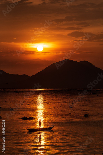 Wallpaper Mural Fishing under a full round sun during a beautiful sunset Torontodigital.ca