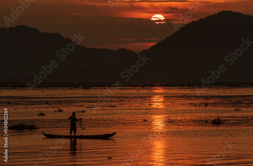 Wallpaper Mural Fishing under a full round sun during a beautiful sunset Torontodigital.ca