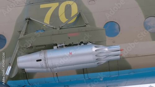 The block of unguided aircraft missiles of the Mi-8 military helicopter allows you to accommodate many powerful missiles in one block, which is a formidable weapon. Closeup photo