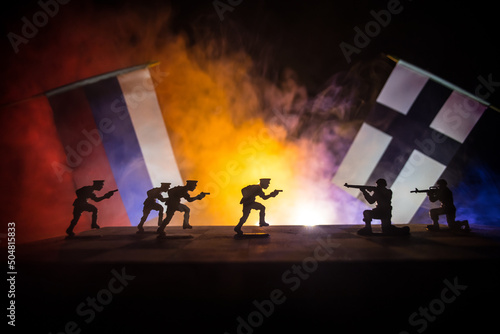 BAKU, AZERBAIJAN - March 3, 2020: Flag of NATO ( North Atlantic Treaty Organization and Russia on dark background. Concept of crisis of war and political conflicts between nations. Selective focus photo