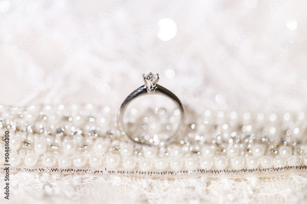 Wedding ring on wedding dress background Wedding ring on wedding dress background