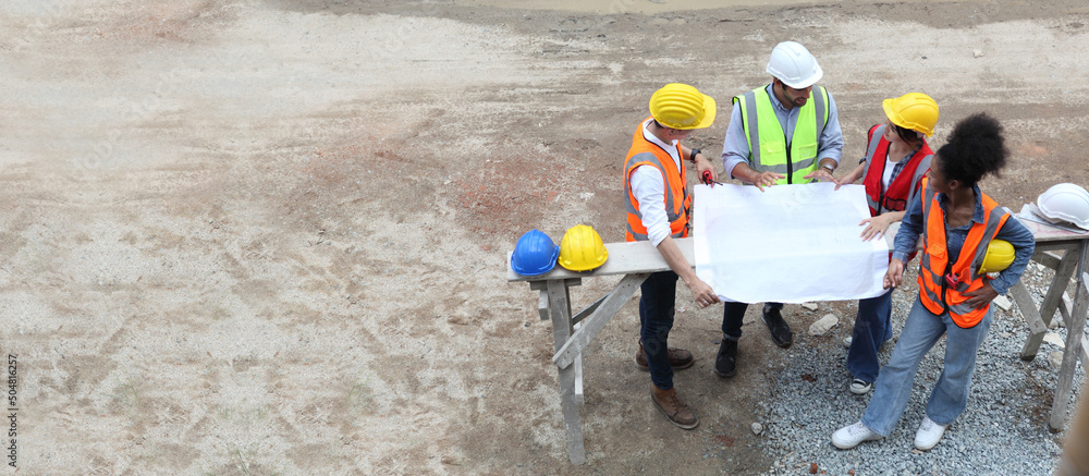 engineering or worker meeting discuss at construction site ,top view and copy space