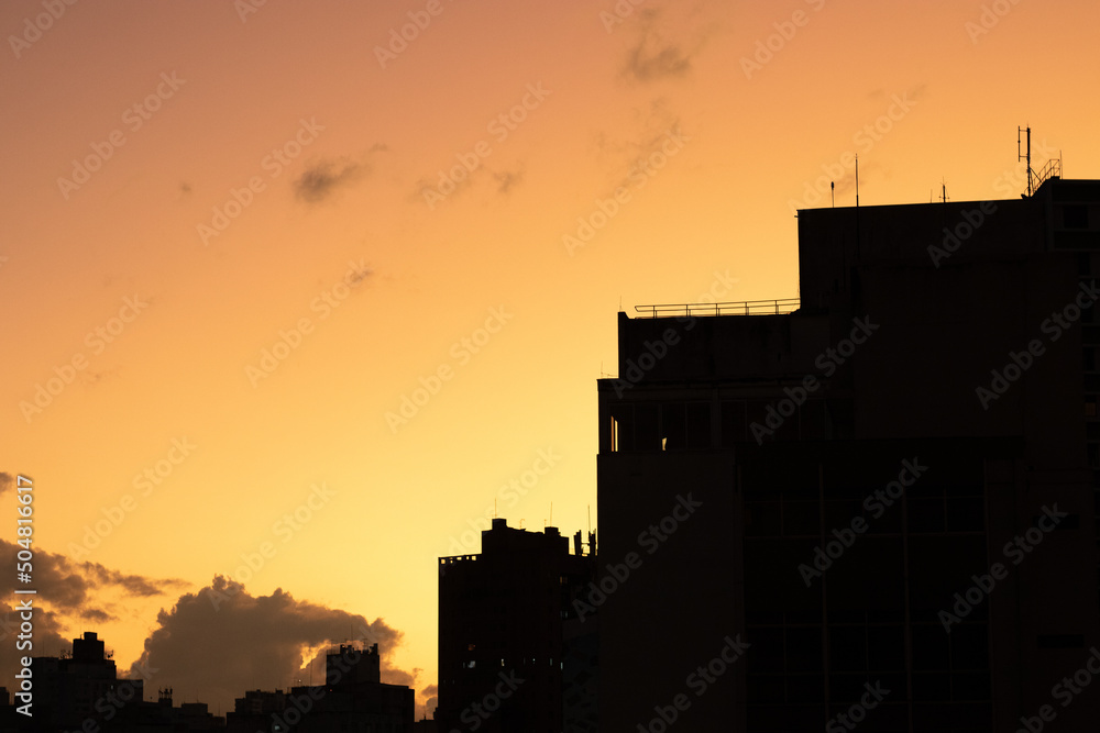 Beautiful orange sunset and silhouette of buildings, city center of Sao Paulo, Brazil.
