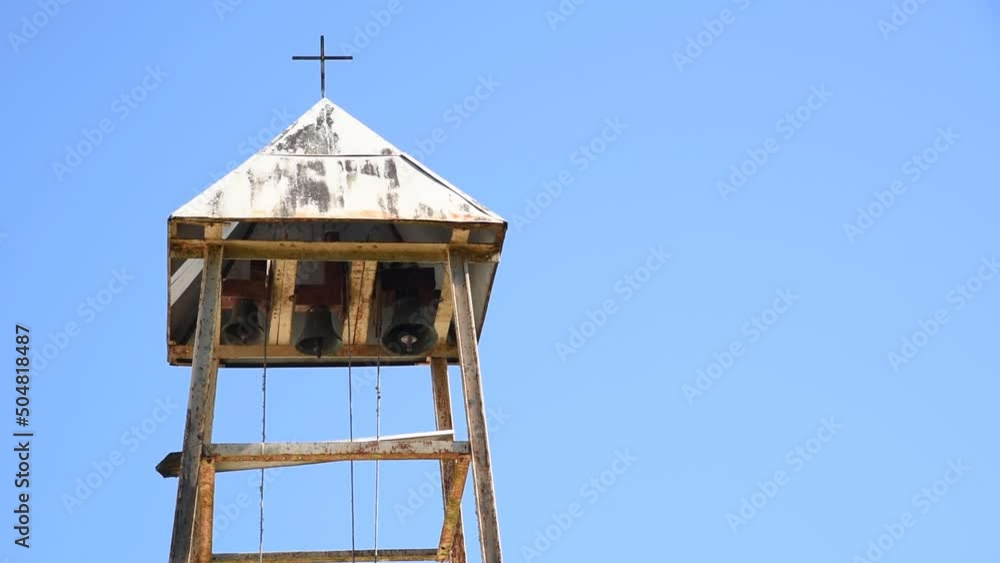 Belfry with three bells and ropes on the blue background Belfry with three bells and ropes on the blue background