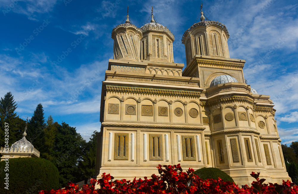 View of Romanian Orthodox Cathedral of Curtea de Arges in sunny autumn day