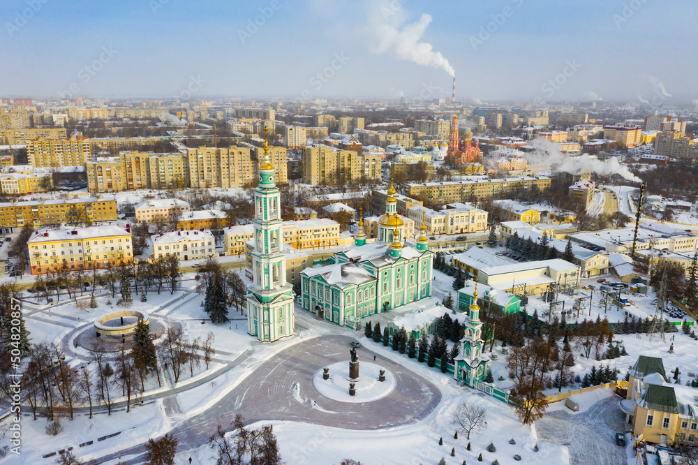 Winter aerial view of Tambov cityscape and Orthodox Transfiguration Cathedral covered with snow, Russia