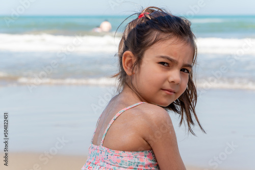 Selective Focus Shot Image Of Little Girl On The Beach.