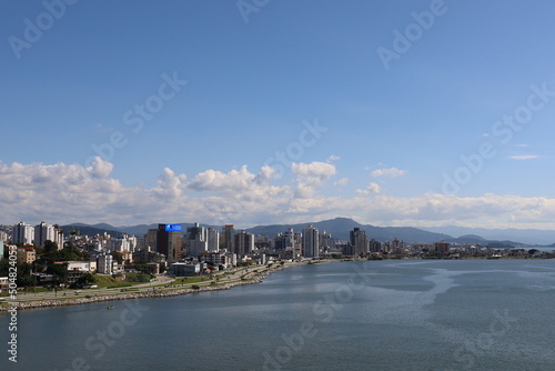 City on the ocean coast sea promenade sandy Brazil Florianopolis beautiful view from the water to tall buildings from a height