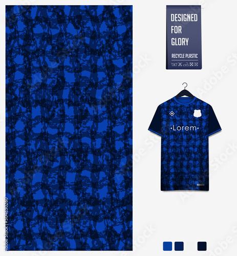 Soccer jersey pattern design. Camouflage pattern on dark blue background for soccer kit, football kit or sports uniform. T-shirt mockup template. Fabric pattern. Abstract background.  photo