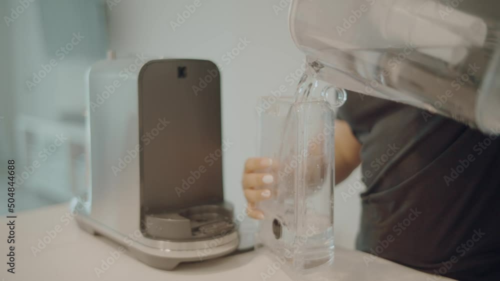 Filling Up Water Tank with Purified Water of a Breville Nespresso