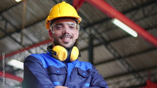 Portrait of Professional industrial engineer, technician, factory worker, machinery operator wear safety uniform, hardhat, safety glasses look at camera, smile. Employee working at industry factory.