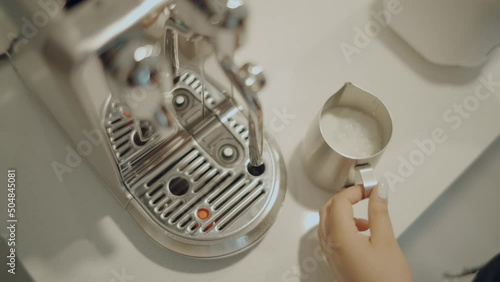 Frothing Milk, Milk Foam, Flat White Coffee Making Process with a Breville Nespresso Creatista Plus Machine photo