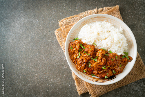 Fotografi chicken tikka masala with rice on plate