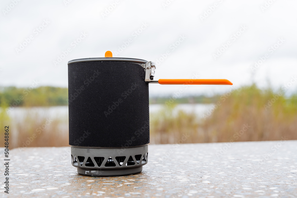 Tourist utensils pot for boiling water quickly, heat exchanger at the