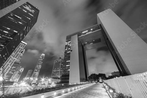 Photography modern skyscraper in Hong Kong city at night
