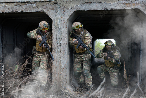 Three military mercenary soldiers during special operation. © Stavros