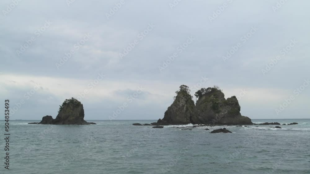 Dramatic clouds over sea stacks in the sea in Izu Peninsula, Shizuoka Prefecture, Japan Dramatic clouds over sea stacks in the sea in Izu Peninsula, Shizuoka Prefecture, Japan