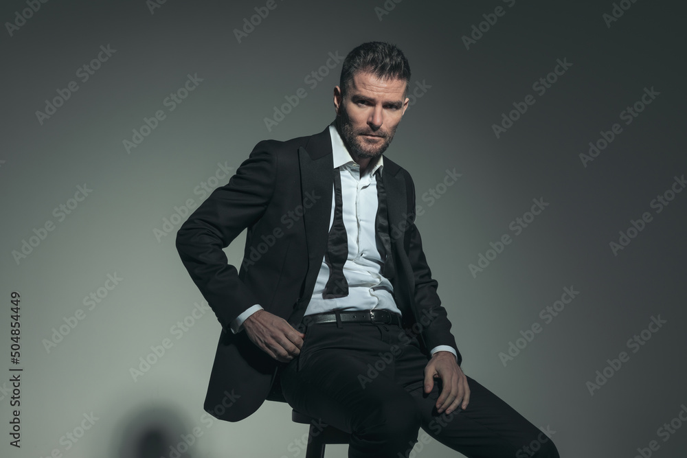 unshaved sexy man posing in a confident manner unshaved sexy man posing in a confident manner