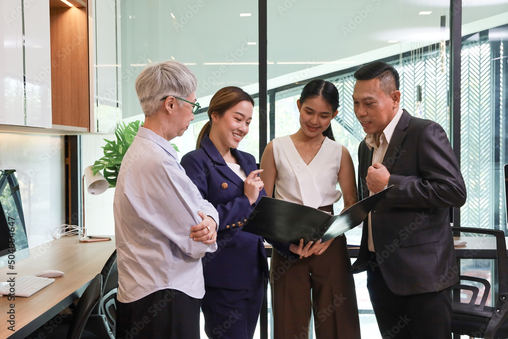 Group of business team talking and discussing and brainstorming about result in the report in office, colleagues and teamwork meeting concept Group of business team talking and discussing and brainstorming about result in the report in office, colleagues and teamwork meeting concept
