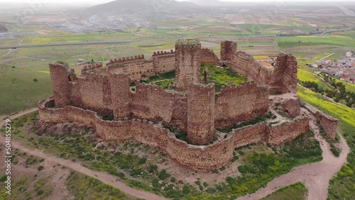 Scenic aerial view of remains of medieval fortified Castle of Almonacid on hilltop in Spanish province of Toledo on spring day photo