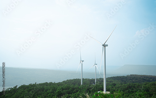 Wind Turbines Windmill Energy Farm.Sustainability Electrical generator renewable background.Hill and sky landscape wind mill ecological green concept.Reduce global warming.