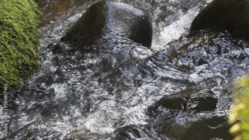 Close up of moving water in a small creek photo