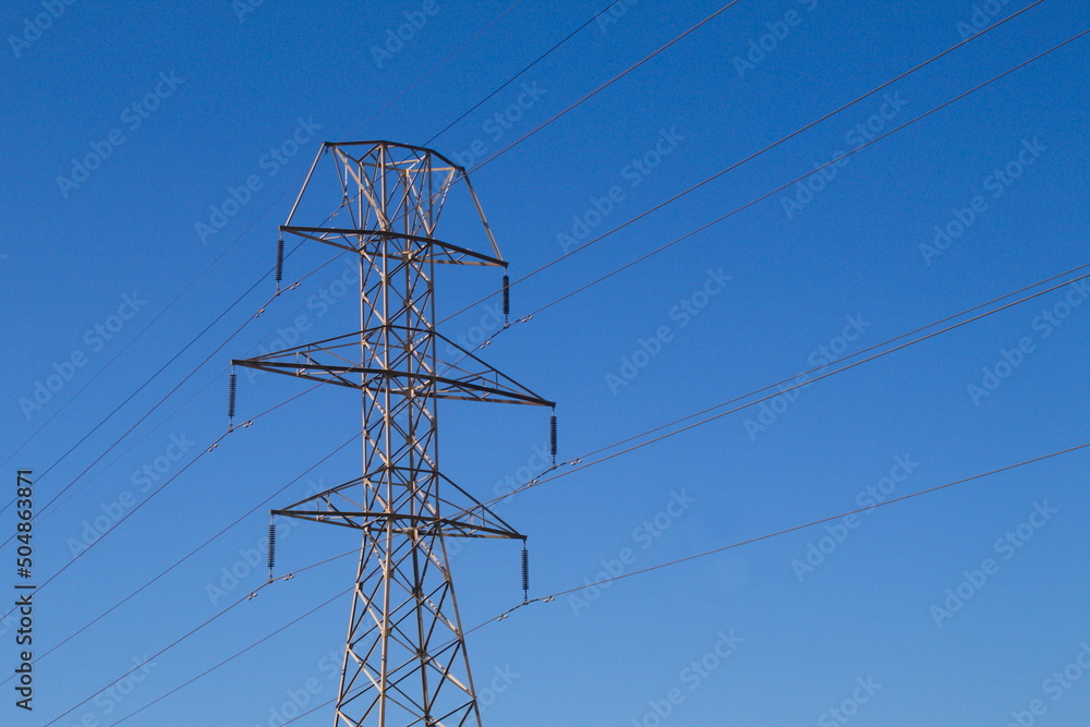 Metallic towers with cables that carry electricity to supply businesses and homes
Metallic towers with cables that carry electricity to supply businesses and homes