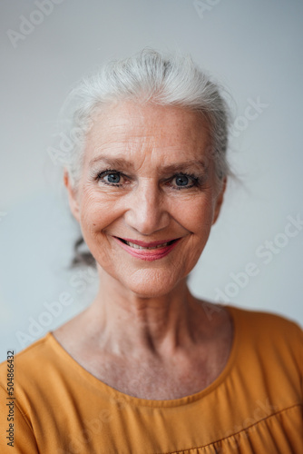 Wallpaper Mural Happy senior woman with gray hair against white background Torontodigital.ca