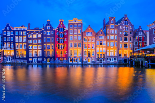 Canvas Print Amsterdam, Netherlands. Colorful houses at the Damrak canal.