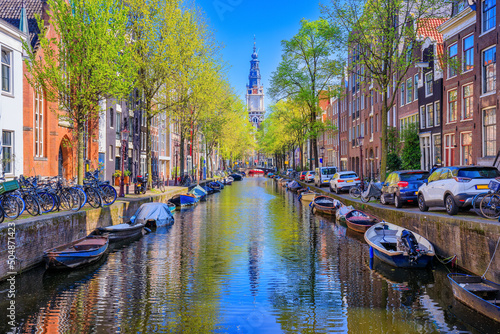 Amsterdam, Netherlands. Groenburgwal canal with Zuiderkerk tower in the background.