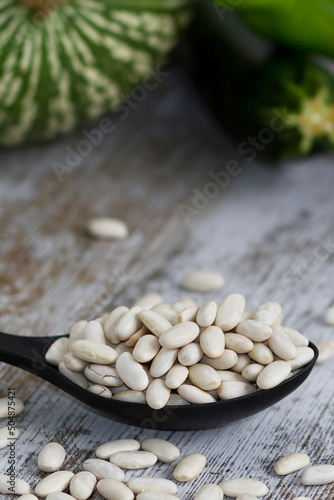 raw white beans with vegetables for cooking background photo