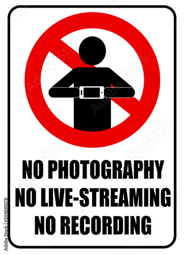 No photography, no live streaming, no recording. Prohibition sign with a silhouette of a person holding a smartphone. Text.