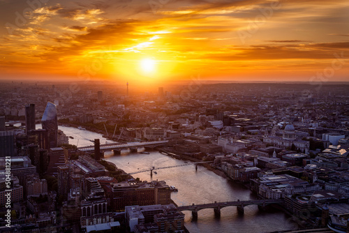 Beautiful  elevated sunset behind the skyline of London with bridges over the Thames river and St. Pauls Cathedral  England