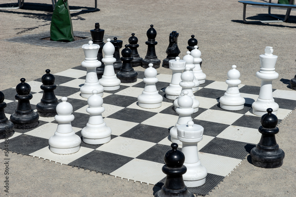 Outdoor large chess. Chess pieces. Outdoor entertainment and games