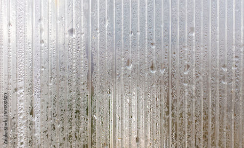 Water drops on a plastic window as an abstract background.